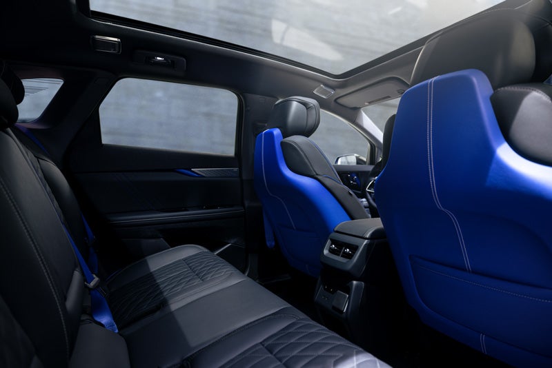 Back Seat View of the 2026 OPTIQ-V Blue Front Seats, Sun Roof, and Interior | Williamson Cadillac in Miami FL
